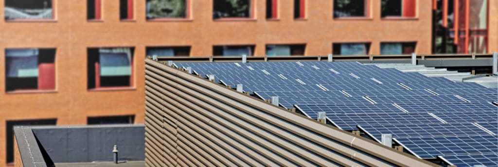 Photo of a solar panel on top of a building.